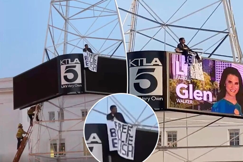 Man Climbs California News Tower, Waves ‘Free Billie Eilish’ Sign in Daring Protest Man-scales-California-news-tower-waves-Free-Billie-Eilish-sign